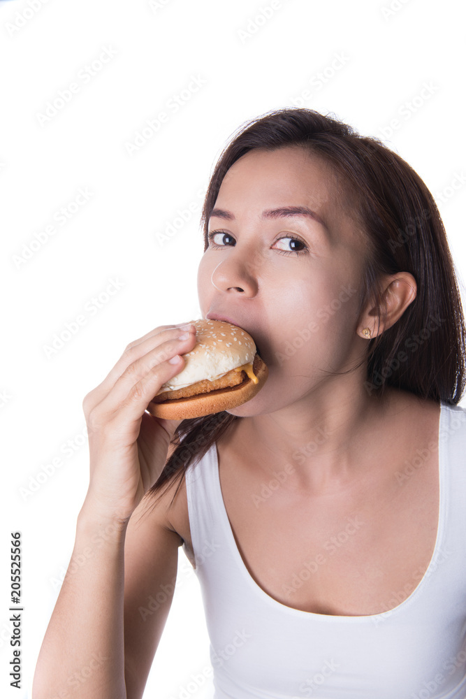 woman biting hamburger on white background