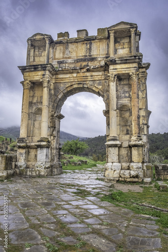 Arch of Caracalla in roman town Cuicul at village Djemila, Algeria