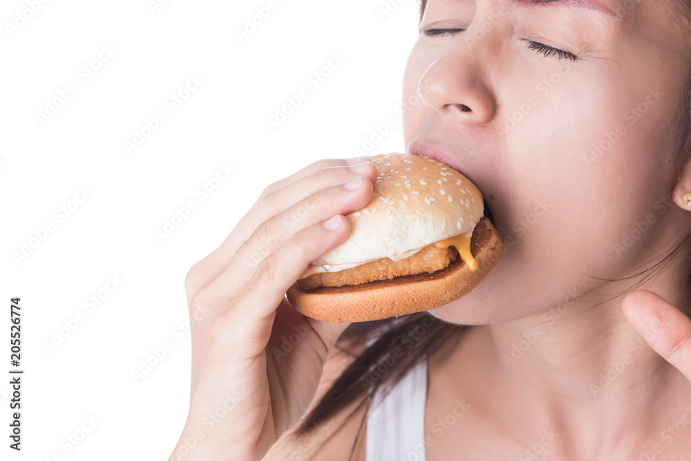 woman biting hamburger on white background