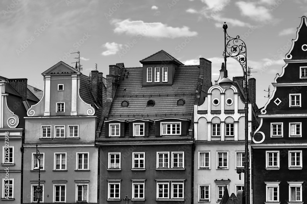 Central market square in Wroclaw Poland with old houses and street lantern lamp. Travel vacation concept. Black and white