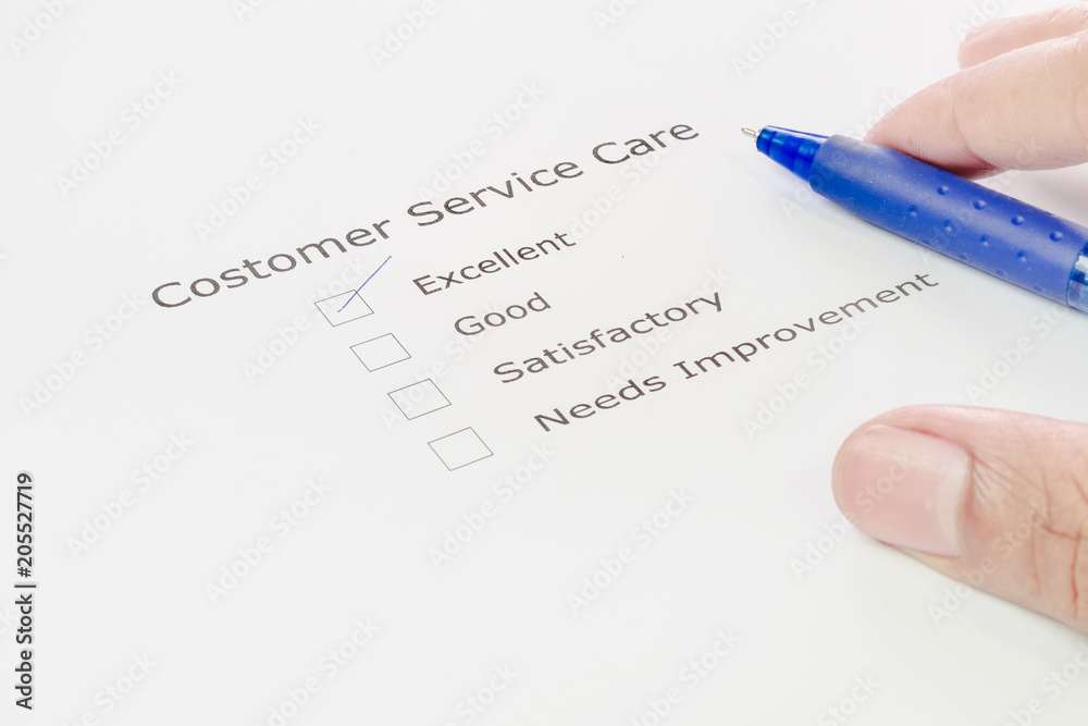 Hand with pen over customer service care application form. Hand with pen over customer service care application form.