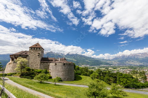 Vaduz Castle with mountain road in Liechtenstein. Alps landscape