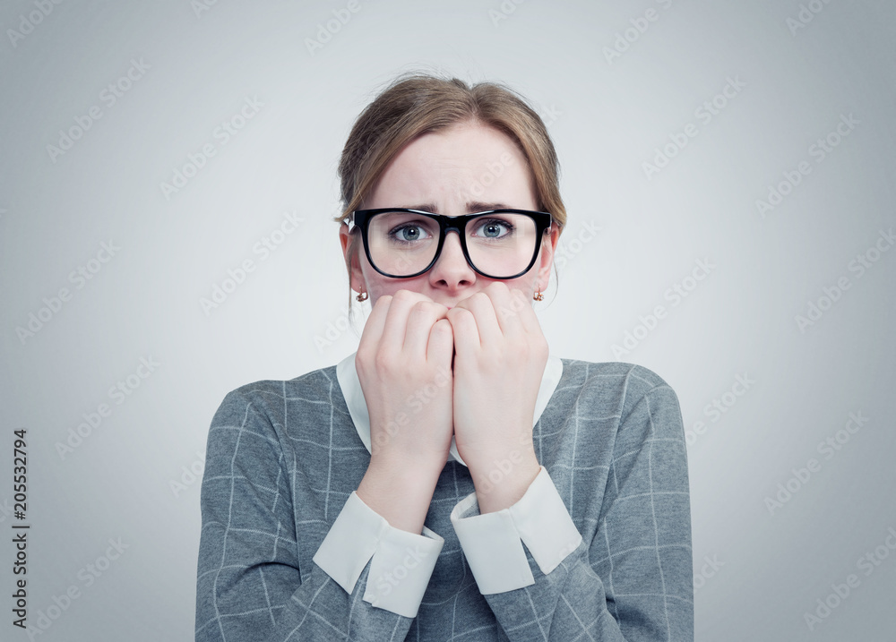 Young girl with glasses is very afraid. Deep fear concept emotion Young girl with glasses is very afraid. Deep fear concept emotion