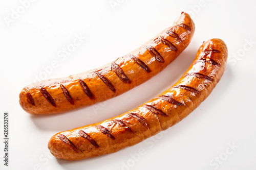 Two seared barbecue sausages with copy space
