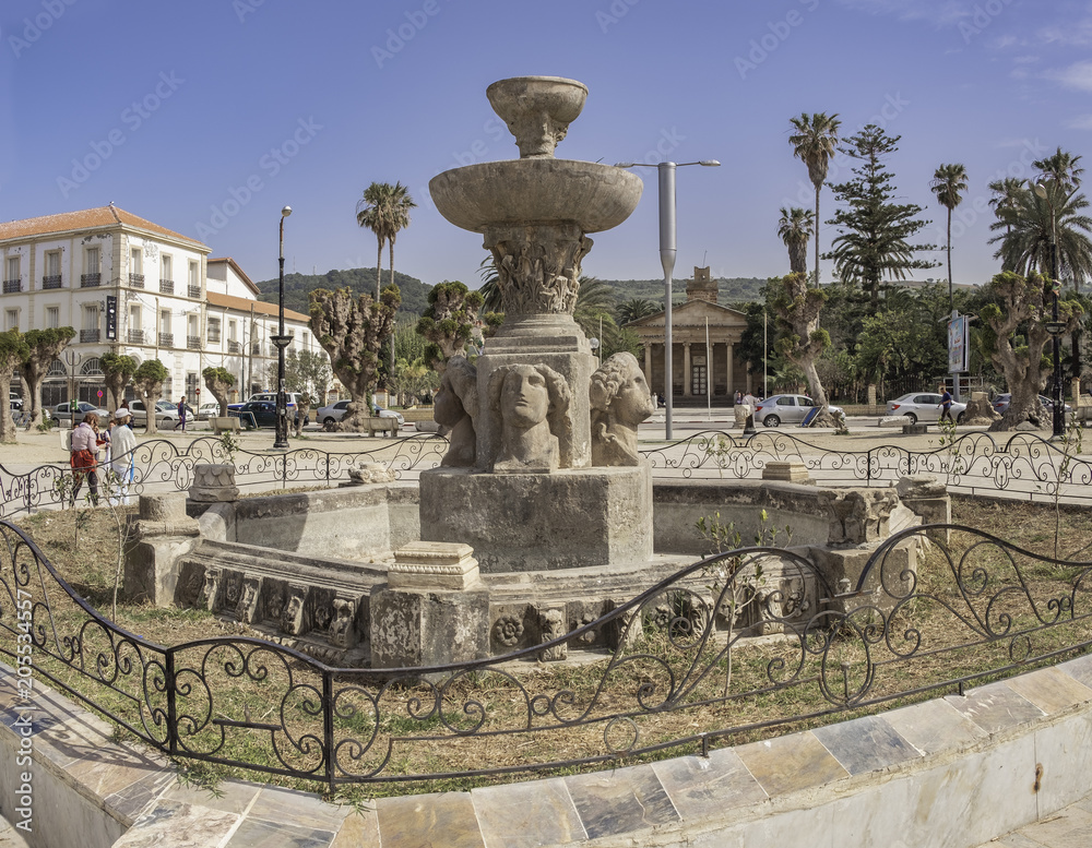 Sculptures of roman town Caesarea Iol on displey at fountain in Cherchel, Algeria