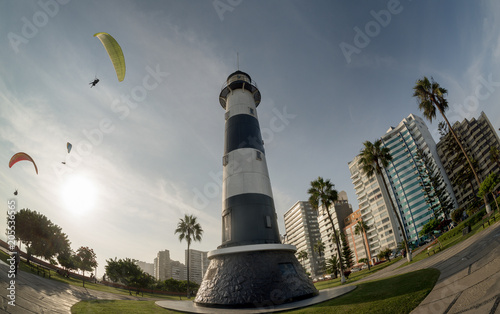 LIMA, PERU: MIRAFLORES LIGHTHOUSE AND PARAGLIDES. photo