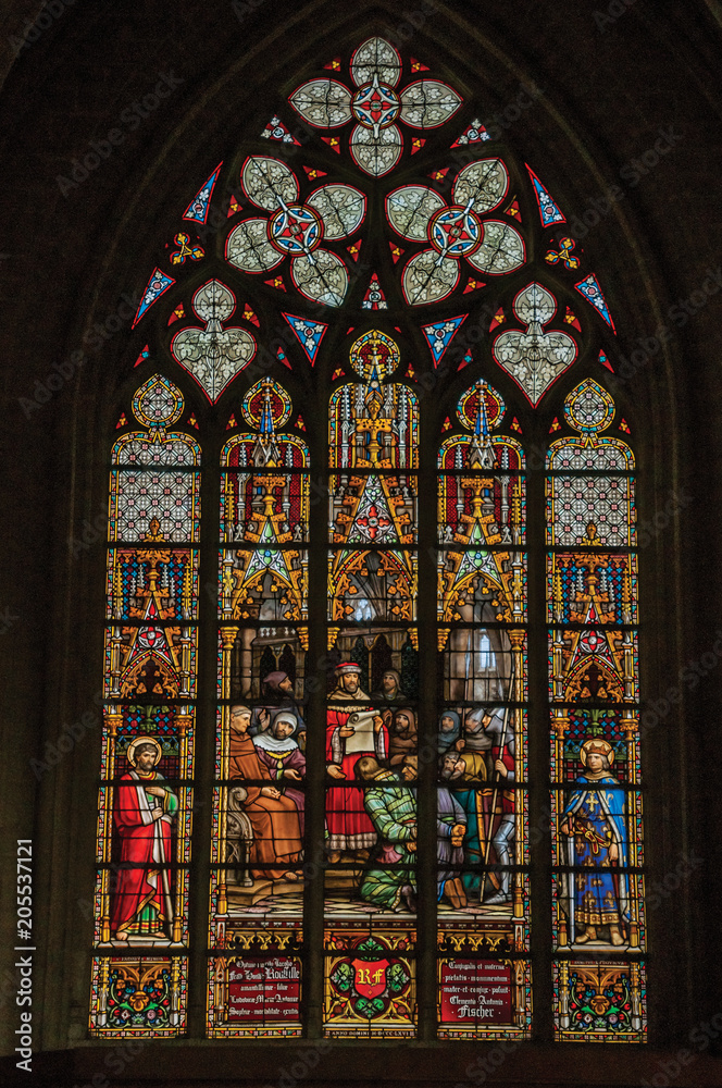 Colorful stained glass window in the St. Michael and St. Gudula Cathedral at Brussels. It is the country’s capital and administrative center of the EU. Central Belgium