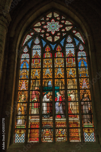 Colorful stained glass window in the St. Michael and St. Gudula Cathedral at Brussels. It is the country   s capital and administrative center of the EU. Central Belgium