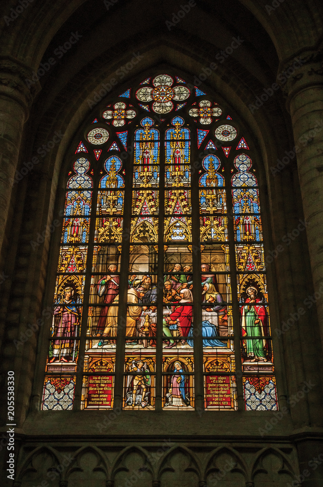 Colorful stained glass window in the St. Michael and St. Gudula Cathedral at Brussels. It is the country’s capital and administrative center of the EU. Central Belgium
