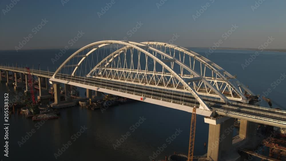 Aerial view of The Crimean Bridge, Kerch Bridge, colloquially the Kerch Strait Bridge with road and rail passages across the Kerch Strait, which will connect the Taman Aerial view of The Crimean Bridge, Kerch Bridge, colloquially the Kerch Strait Bridge with road and rail passages across the Kerch Strait, which will connect the Taman