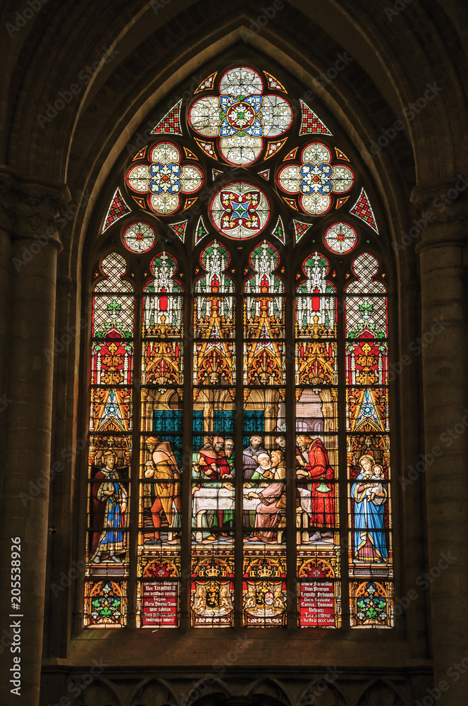 Colorful stained glass window in the St. Michael and St. Gudula Cathedral at Brussels. It is the country’s capital and administrative center of the EU. Central Belgium Colorful stained glass window in the St. Michael and St. Gudula Cathedral at Brussels. It is the country’s capital and administrative center of the EU. Central Belgium