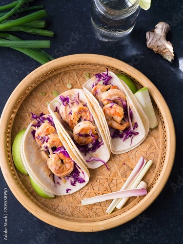 Asian flavored shrimp tacos with red cabbage and green apple slaw