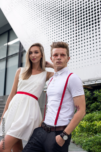Good looking young woman and man wearing white and red clothes