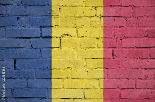 Chad flag is painted onto an old brick wall photo