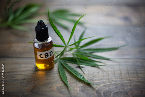 Medicinal cannabis with extract oil in a bottle