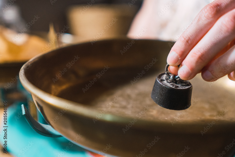 Small weight putting on scales indoors Small weight putting on scales indoors