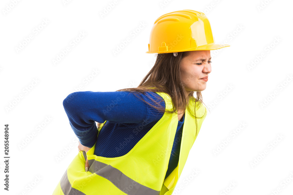 Young female engineer feeling strong back pain. Young female engineer feeling strong back pain.