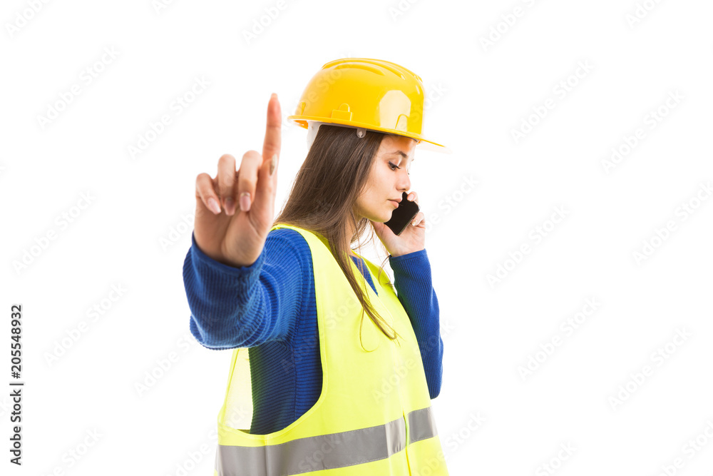 Young woman architect making hold gesture. Young woman architect making hold gesture.