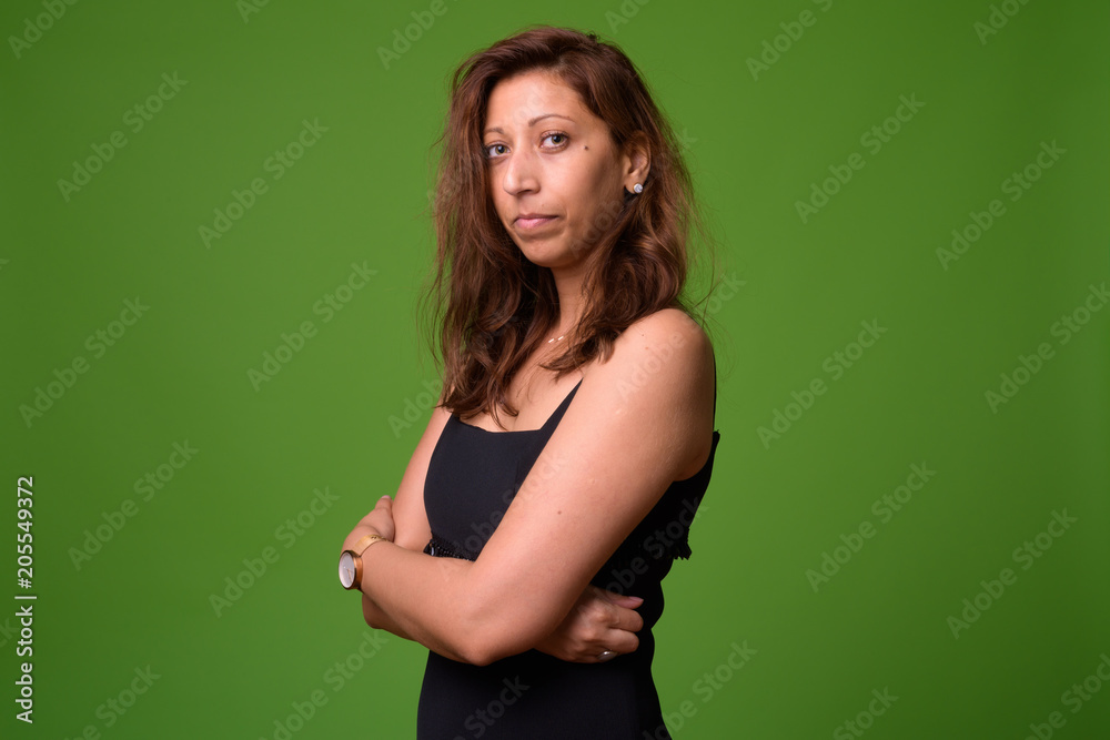 Beautiful woman against green background Beautiful woman against green background