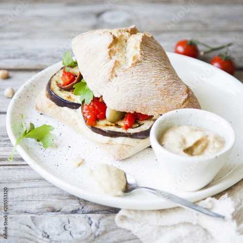Healthy vegan sandwich on rustic background.