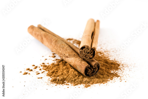 Cinnamon sticks and powder isolated on white background
