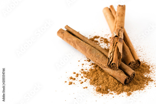 Cinnamon sticks and powder isolated on white background. Copyspace
