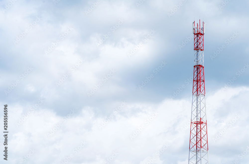 Mobile telecommunication tower with communication antennas in the background of dense clouds Mobile telecommunication tower with communication antennas in the background of dense clouds