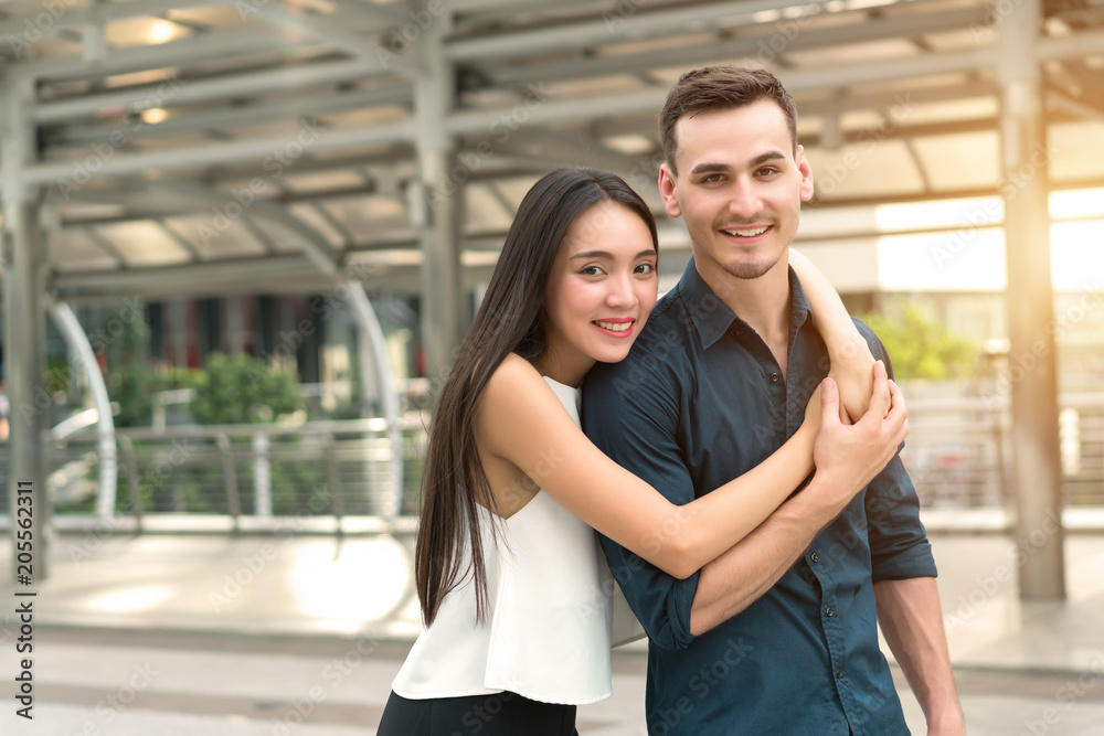 Handsome man and beautiful woman is lover happy with hug together. Concept of people love, valentine day, relationship, travel honeymoon and good feeling.