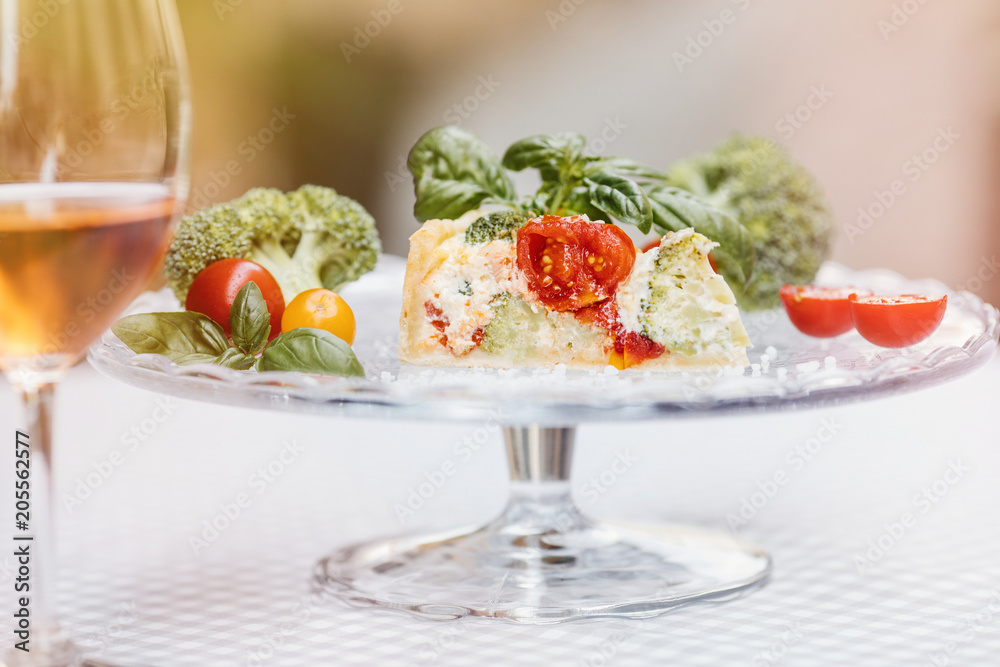 Delicious vegetarian pie and wine , Quiche with tomatoes, brocc Delicious vegetarian pie and wine , Quiche with tomatoes, brocc