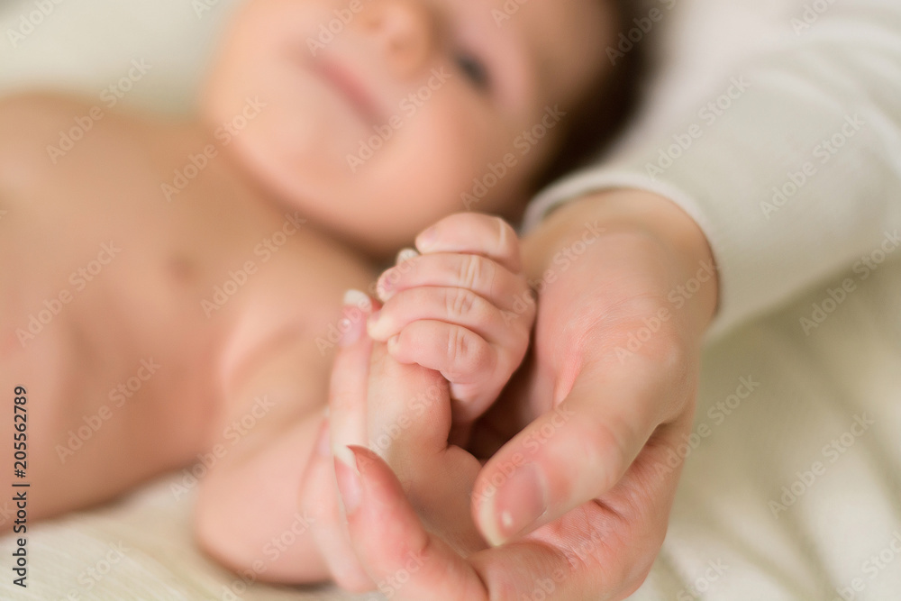 the hand of the newborn in the hands of the mother the hand of the newborn in the hands of the mother