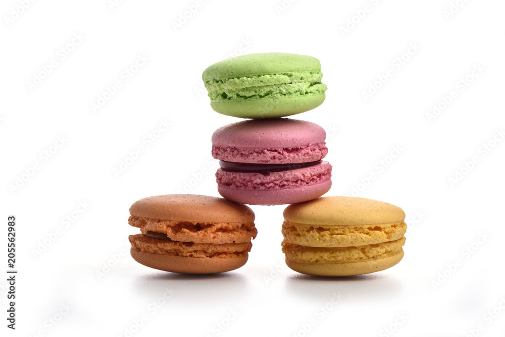 Green, pink, orange and yellow macaroons isolated on white Green, pink, orange and yellow macaroons isolated on white