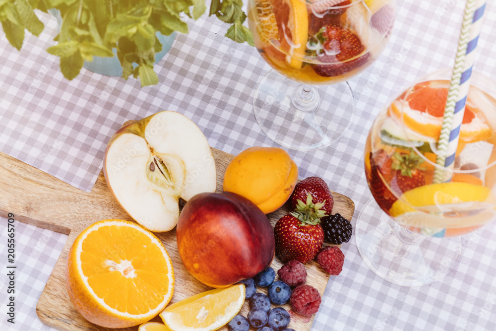 Top view of summer dinks, fruit cocktails on white wood table wi Top view of summer dinks, fruit cocktails on white wood table wi