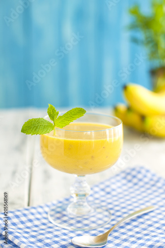 Fresh banana juice, a sunny morning. Healthy breakfast. Copy space