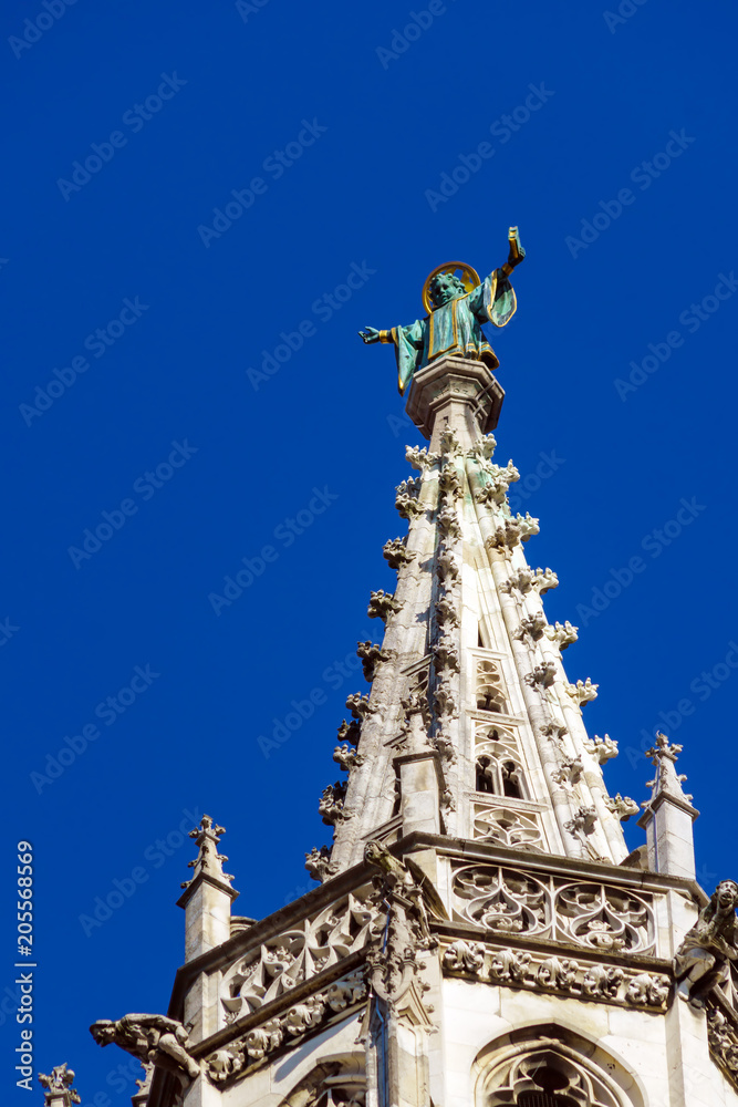 Statue of monk on top of Rathaus, symbol of city, Munich, Germany