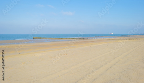 Recreational beach along the North Sea below a blue sky in spring