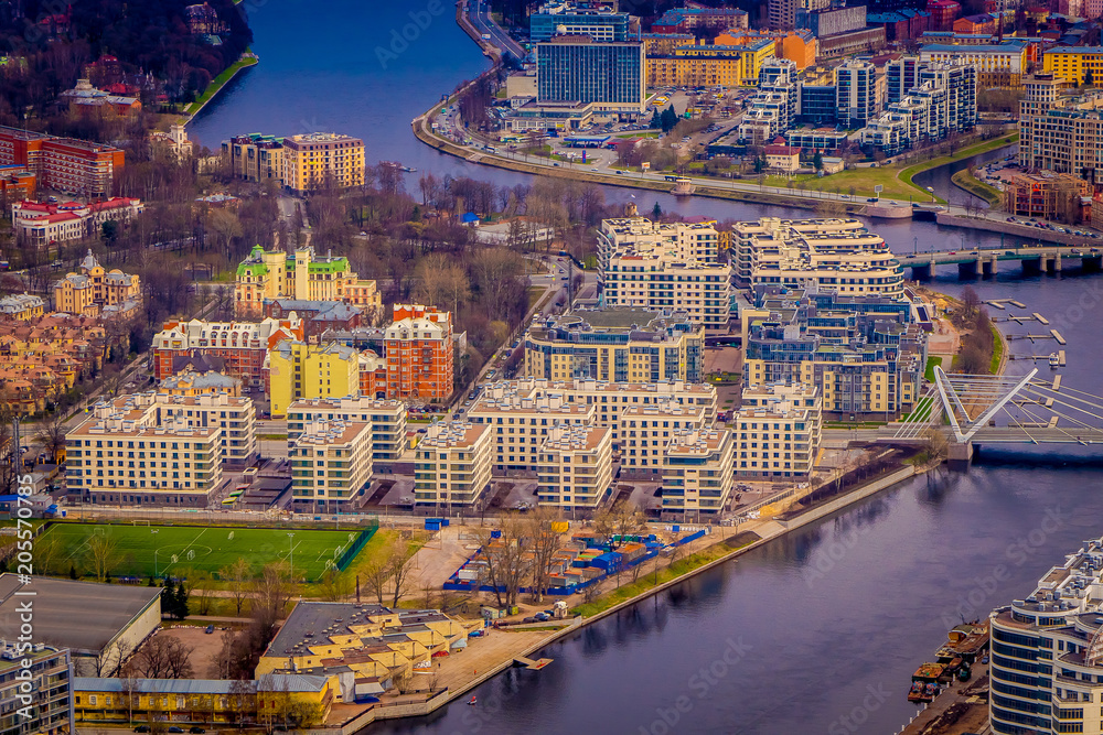 Beautiful aerial panoramic view of the Neva River with some buildings of the city from a height, in the summer, St. Petersburg