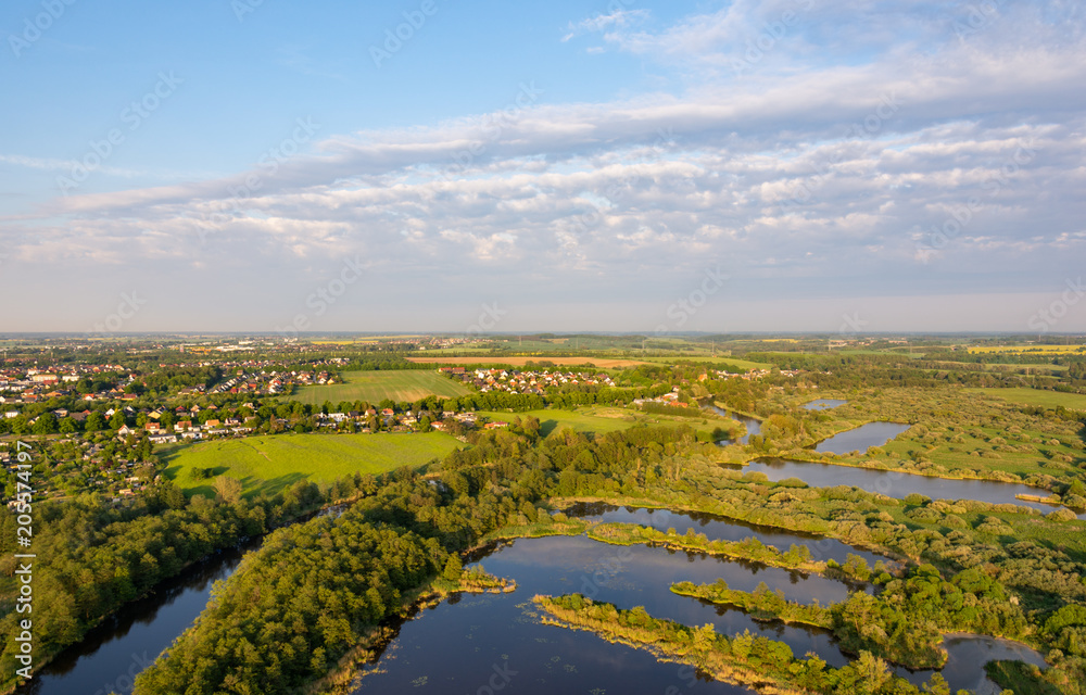 Fototapeta premium aerial view of the river warnow and lakes near rostock