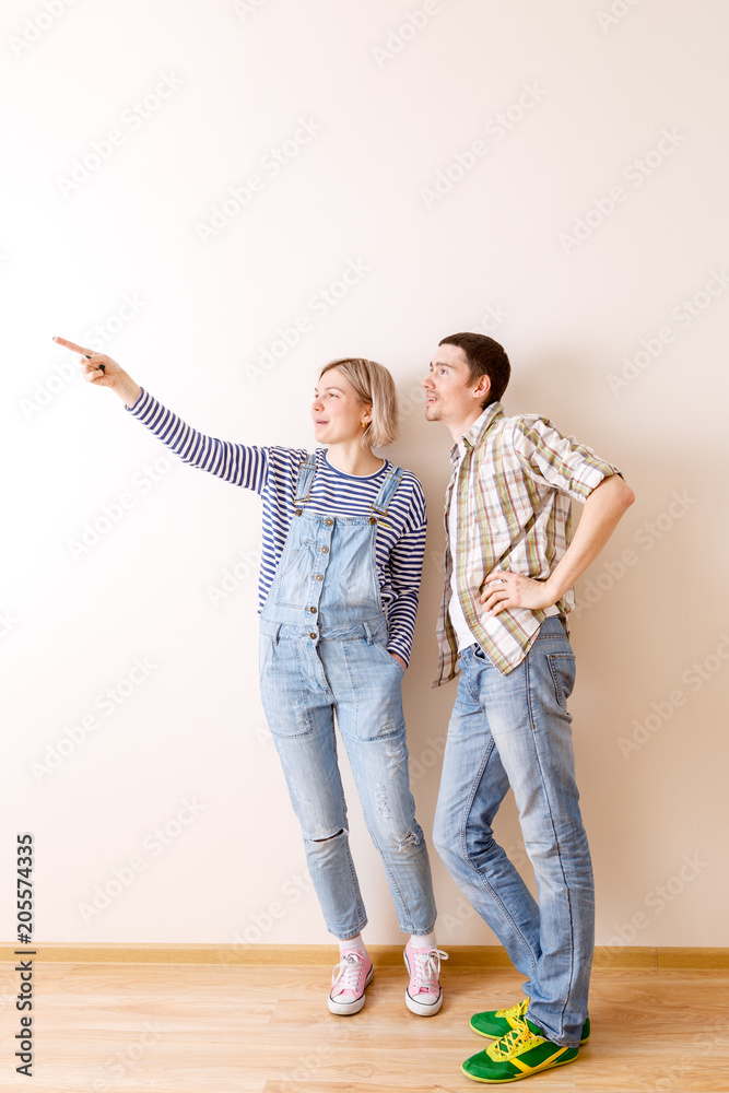 Image of man and woman in new empty apartment Image of man and woman in new empty apartment