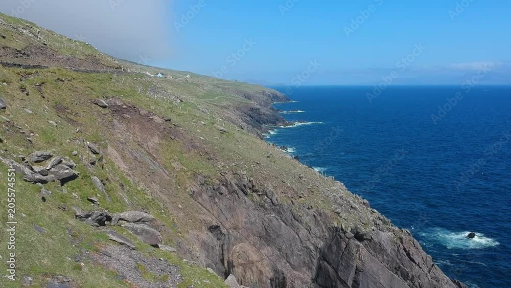 Flight over the Atlantic coast line of Dingle Peninsula in Ireland Flight over the Atlantic coast line of Dingle Peninsula in Ireland