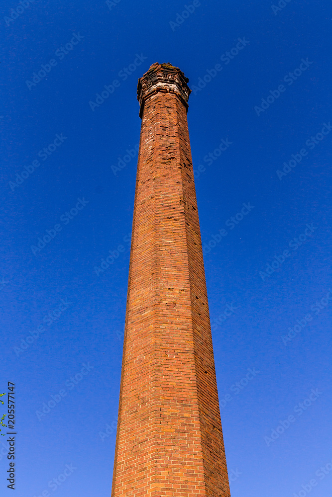 light-colored mop, tower of red old brick