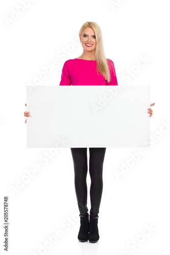 Smiling Beautiful Blond Woman Is Holding Empty Poster