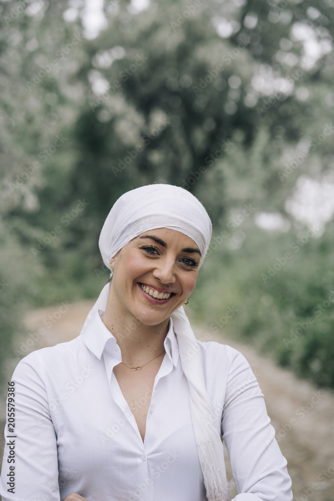 woman with white headscarf in the forest, has cancer woman with white headscarf in the forest, has cancer