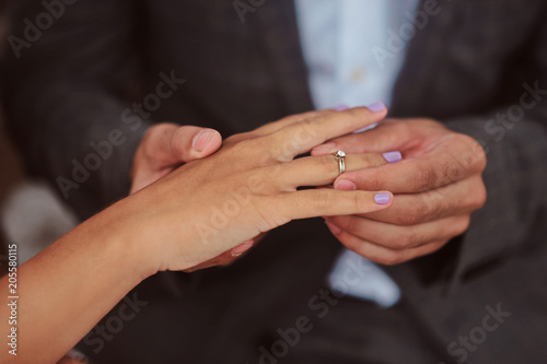 Hands of newlyweds or young lovely couple. Pair of lovers hands close up. Love together concept