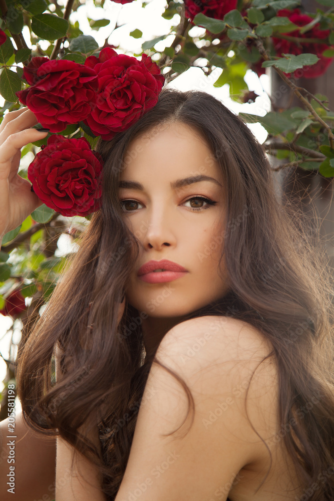 beautiful lady in a rose garden