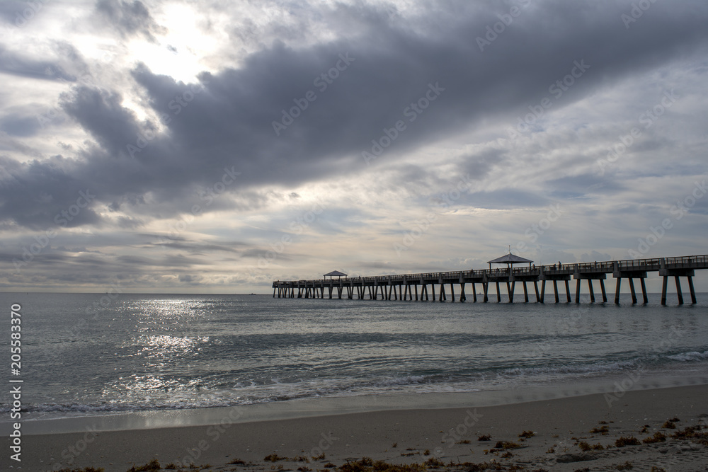 Gray day at the pier, sunsetting