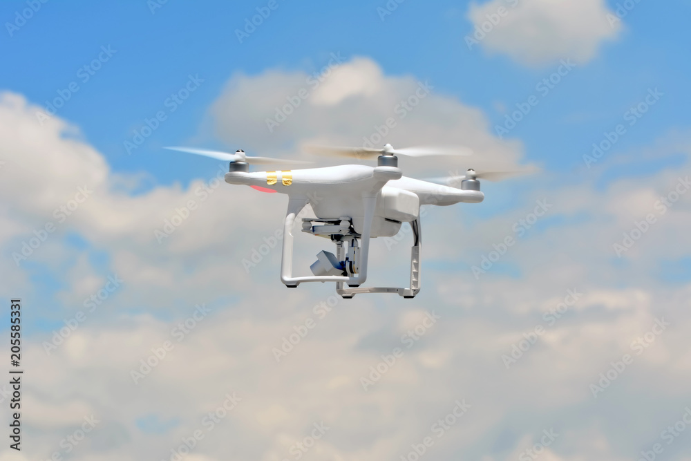Modern drone flying outdoor, RF photo, no logos or trademarks Modern drone flying outdoor, RF photo, no logos or trademarks