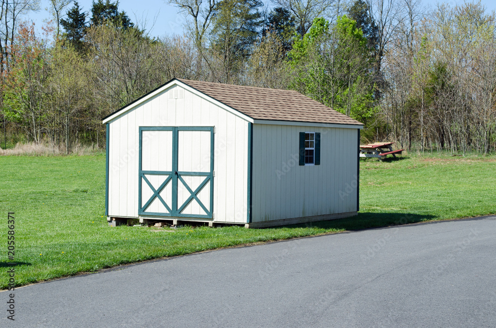 small wooden cabin in park small wooden cabin in park
