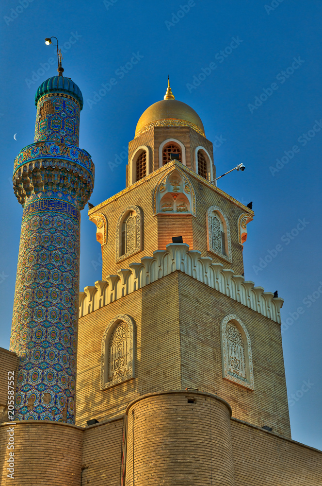 Two joint situated minarets of different eras at The Great Mosque of Kufa