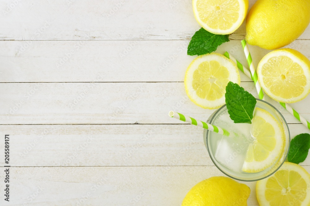 Sweet summer lemonade. Top view side border with copy space on a rustic