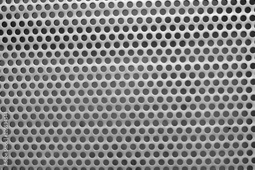 steel surface with little round holes